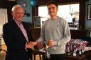 Sponsor Derek Boorman, left, presents Poppleton's Pat Evans with the Tyke Petroleum Men's League champions trophy