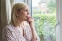 A generic photo of a woman suffering from agoraphobia, looking out of her window. See PA Feature HEALTH Agoraphobia. Picture credit should read: Thinkstock/PA. WARNING: This picture must only be used to accompany PA Feature HEALTH Agoraphobia.