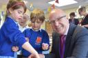 HONOUR: Richard Ludlow, pictured here with Ebor Academy Trust pupils, has got an OBE