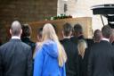 The coffin of Mark Webb is carried into the chapel at York Crematorium
