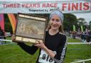 York Knavesmire Harriers’ new recruit Rose Mather celebrates being the first lady back at the Yorkshire Three Peaks race