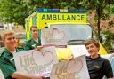 Yormed ambulance technicians Ashley Mason, left, Danny Watt and trainee Chris Chadwick, right, with the Life Savers vehicle signs