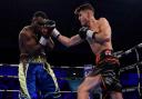 York boxing prospect George Davey lands a right uppercut on Serge Ambomo. Picture: Stephen Dunkley/Queensbury Promotions
