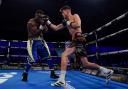 York professional boxer George Davey lands a right hand on Serge Ambomo. Picture: Stephen Dunkley/Queensbury Promotions