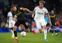 Aston Villa's Jan Bednarek (left) and Leeds United's Patrick Bamford battle for the ball during the Premier League match at Elland Road, Leeds. Picture: Tim Goode/PA Wire