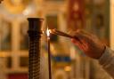 Lighting a candle in memory of a loved one can help remember them at Christmas