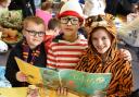 FLASHBACK: Matthew (centre) reads  a story to pupils Tyler (left) and Callum at Settrington Primary School on World Book Day. Pic: Nigel Holland