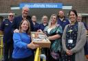 Saint Cecilia’s and hospital staff with one of the hampers