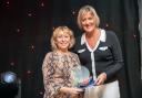 Ann Warriner being presented the Health Service Hero award by Lucy Stoakes