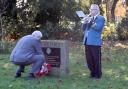 Cllr David Ireton lays a wreath for Remembrance Day at County Hall, with bugler Robert Dawe