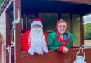 Father Christmas and an Elf on board the brake van at the YWR