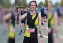 Jack McGuiness after crossing the finish line at the Manchester Marathon
