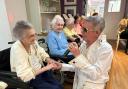 Glen Booth entertaining the residents of Meadowbeck care home dressed as Elvis Presley