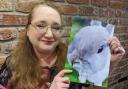 Fiona Brown with a painting of her beloved late rabbit Canape. Fiona is helping to launch a new pet bereavement cafe at The Yorkshire Barn, Murton