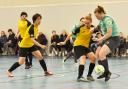 Jessica Baker (in green) on the ball with captain Ellie Whittaker looking on