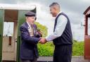 Normandy veteran Ken Cooke being [resented with his model of 'Rowntree No 3' at the Derwent Valley Light Railway