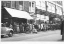 The queue in the 1950s for the Bridge Street branch of York butchers Wrights - with a Jowett Javelin peeping into shot on the left