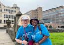 Sue Garland and her carer Nyarai walking around York during the challenge