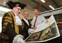Lord Mayor Coun David Horton, Tony Reeves, who designed the layout, and John Richardson, managing director of printers Wood and Richardson, examine the programme for the John Barry tribute concert at the Barbican Centre