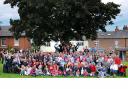 Our photographer, Anthony Chappel-Ross, captured this picture of Tollerton residents on the village green before the official photo was taken by Richard Llewellyn