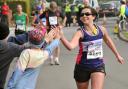 HIGH FIVE: Runners make their way through Osbaldwick in the Yorkshire Marathon
