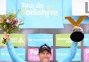 Team Sky's Lars Petter Nordhaug celebrates with the trophy after winning the inaugural Tour de Yorkshire