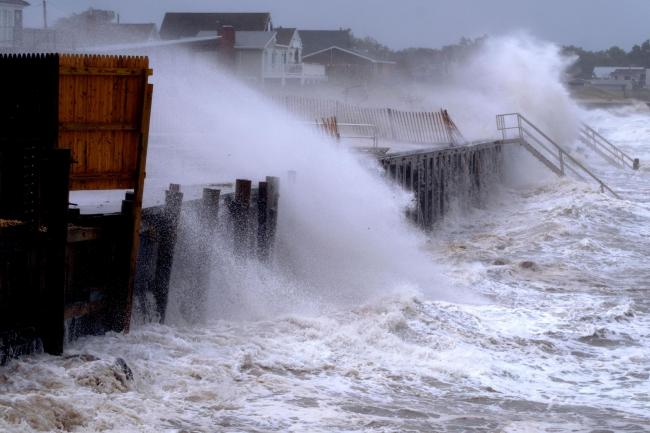 Waves pound a seawall in Montauk, New York as Tropical Storm Henri affects the Atlantic coast