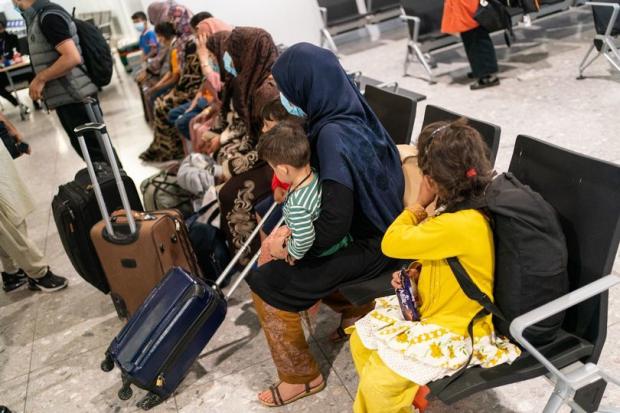 York Press: Afghan refugees arriving into Heathrow airport from Afghanistan (Dominic Lipinski/PA) (PA Wire)