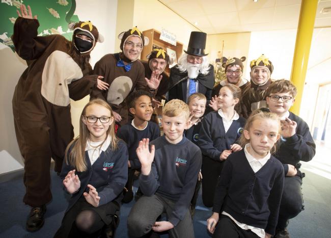 Children with the “chimps” and Professor Lightbulb – consultant psychiatrist Professor Steve Peters – at a special educational theatrical style production at Hob Moor School            Picture: Tim Moat.