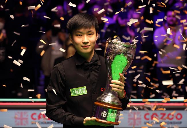 Zhao Xintong lifts the trophy after winning the final of the Cazoo UK Championship at the York Barbican. Picture: Richard Sellers/PA Wire