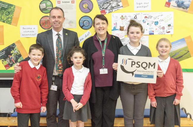 Monk Fryston Primary School wins Primary School Quality Science Mark award, pictured (from left to right) are Harry Callum, Mr Weights (Headteacher), Blossom Simpson, Mrs Walsh (Science Leader), Brooke Mallinson, Mya Mitchell.