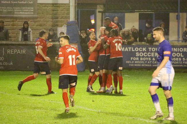 Relieved York City players mob goalscorer Mark Beck after his injury-time winner at Matlock Town. Picture: Mark Comer