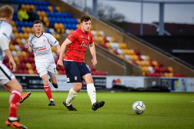 Kieran Wallace plays a pass during York City’s National League North game with Alfreton Town at the LNER Community Stadium. Picture: Adam Davy