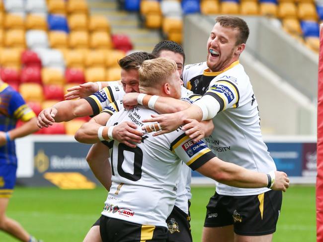 A group of York City Knights players celebrate Jack Teanby's try at the LNER Community Stadium. Picture: Craig Hawkhead