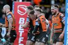 Castleford Tigers half-back Jake Trueman celebrates with his team-mates after a try. Picture: Richard Sellers/PA Wire