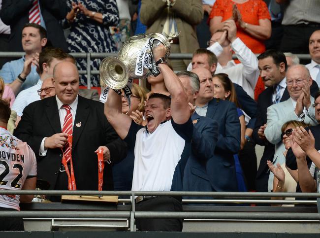 New Castleford Tigers coach Lee Radford lifts the 2016 Challenge Cup trophy at Wembley Stadium while in charge of Hull FC. Picture: Anna Gowthorpe/PA Wire