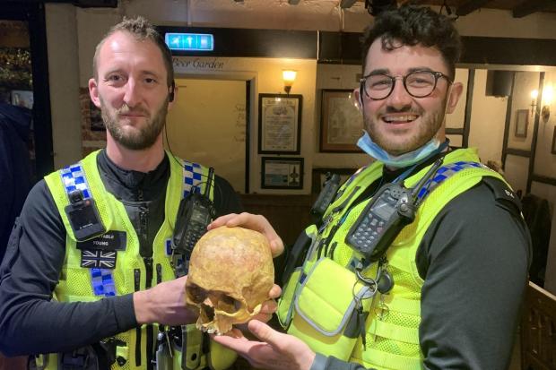 PC David Young and PC Bill Davies with the stolen skull.
