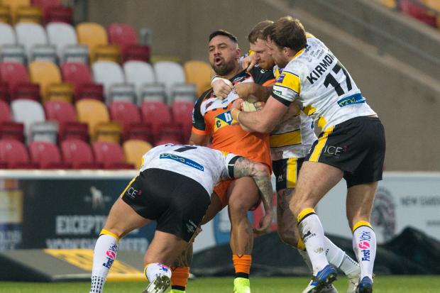 York City Knights’ James Glover and Danny Kirmond are involved in a three-man tackle on a Castleford Tigers man. Picture: Craig Hawkhead