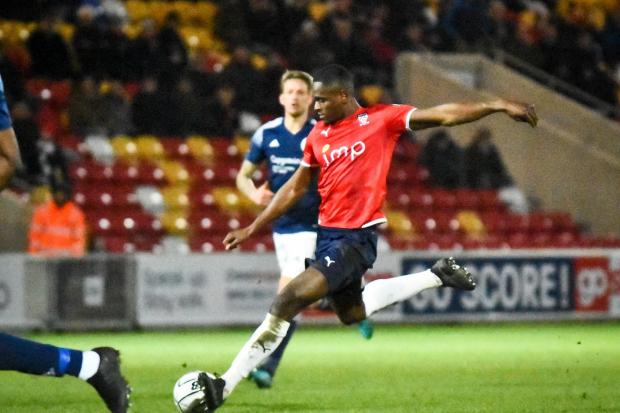 Akil Wright strikes an effort against AFC Telford United. Picture: Tom Poole