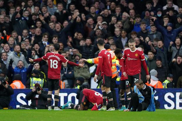 Manchester United's Anthony Elanga (on floor, centre) after being struck by an object thrown from the Elland Road crowd. Picture: Mike Egerton/PA Wire