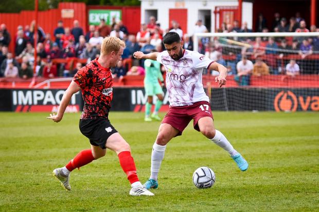 York City winger Maziar Kouhyar faces up to an Alfreton Town defender. Picture: Tom Poole