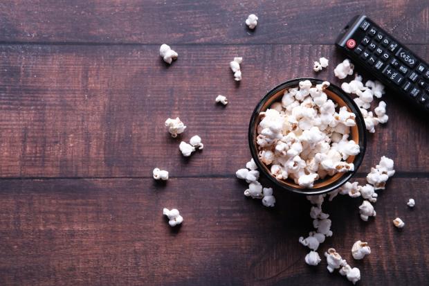 York Press: A bowl of popcorn and a TV remote (Canva)