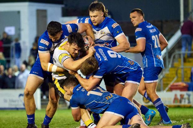 York City Knights winger Will Oakes is tackled by three Barrow Raiders defenders. Picture: Steve Miller