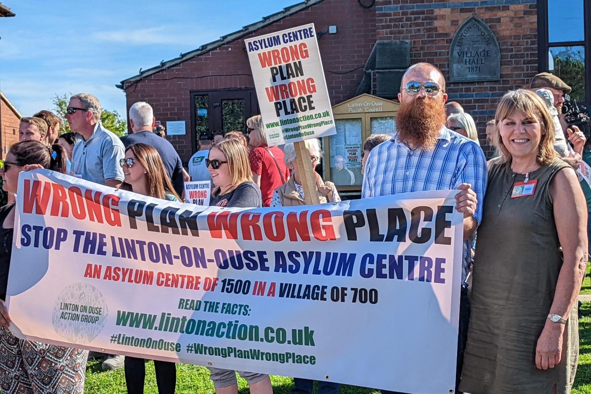 Scores of villagers demonstrated outside Linton on Ouse village hall against plans to open an asylum seeker reception centre at the former RAF Linton on Ouse base  Picture: Ben Ferguson