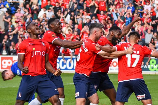 York City players celebrate Maziar Kouhyar’s second goal which secured the victory over Boston United. Picture: Tom Poole