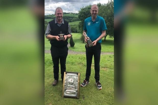 From left, Bruce Macdonald, from Clayton with the Nine-Hole Club Trophy and individual Nett prize and Andrew Busfield with individual gross prize