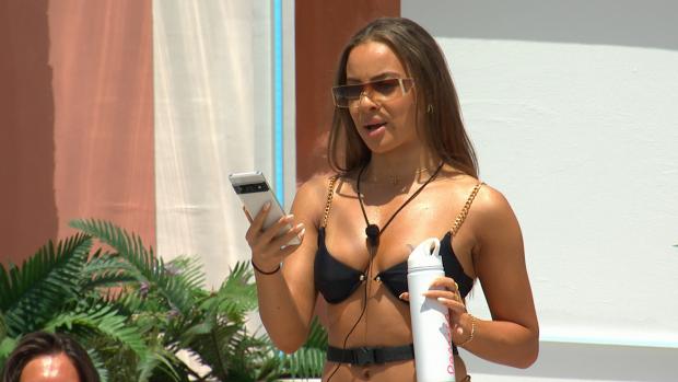 York Press: Danica gets a text as Love Island continues tonight at 9pm on ITV2 and ITV Hub. Episodes are available the following morning on BritBox. Credit: ITV