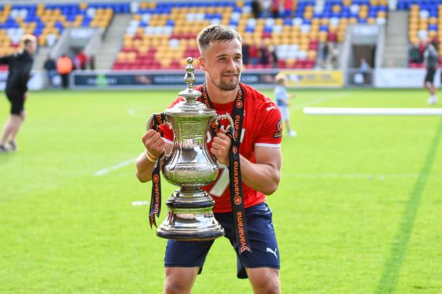 York City's Olly Dyson celebrates beating Boston United 2-0 in the Vanarama National League North play-off final. Picture: Tom Poole