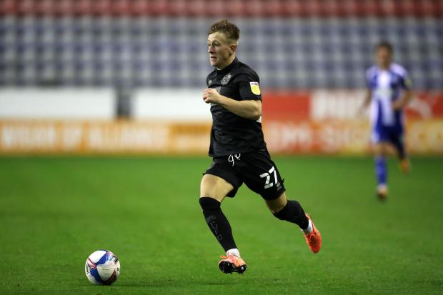York City’s new signing Alex Hurst dribbles with the ball for Port Vale at Wigan’s DW Stadium. Picture: Martin Rickett/PA Wire