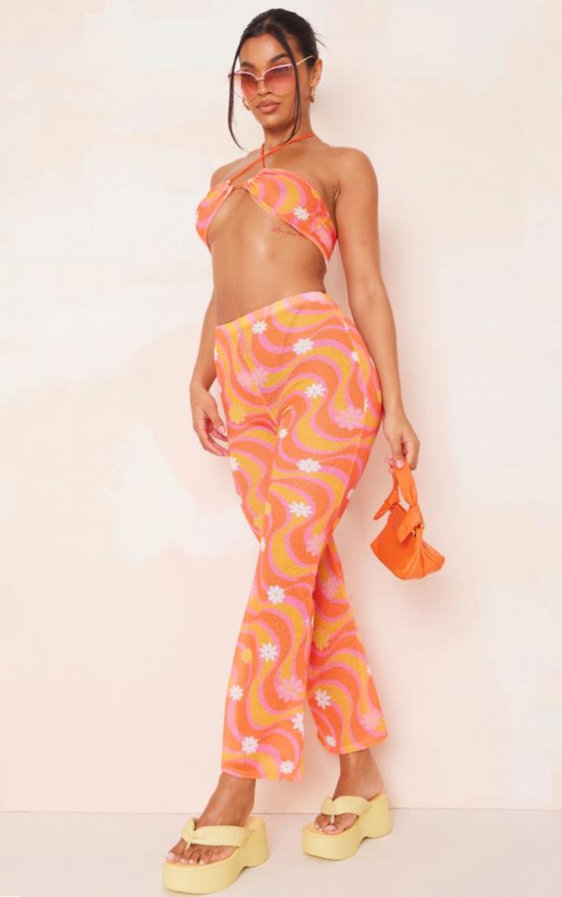 York Press: Orange Flower Swirl Print Knit Flare Trousers (PrettyLittleThing)